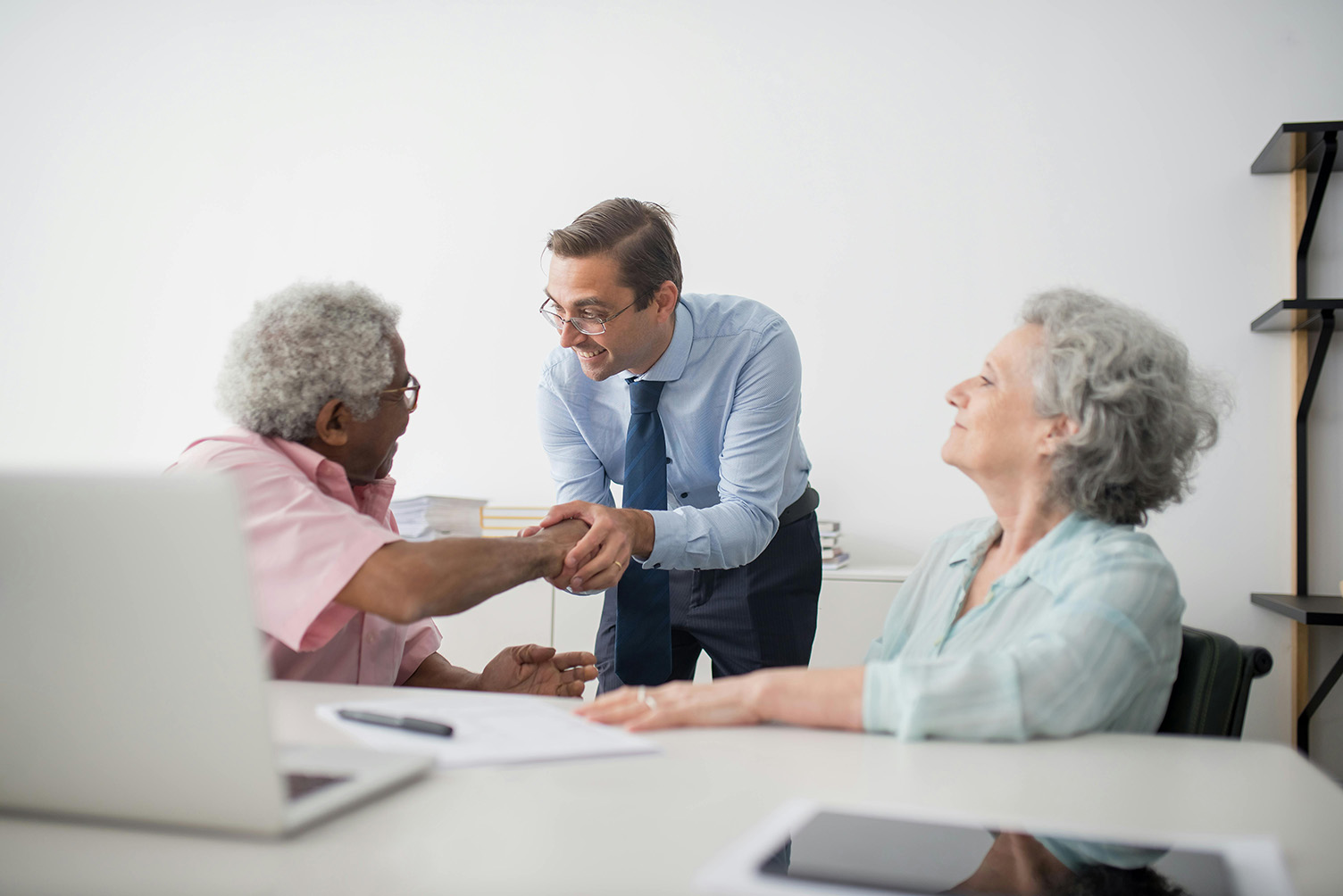 planner shaking hands with client